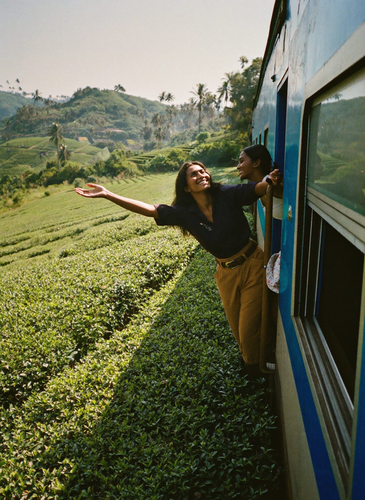 Leaning out of the train through the tea hills near Ella